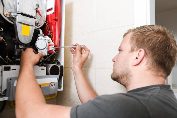 Technician repairing Gas Furnace