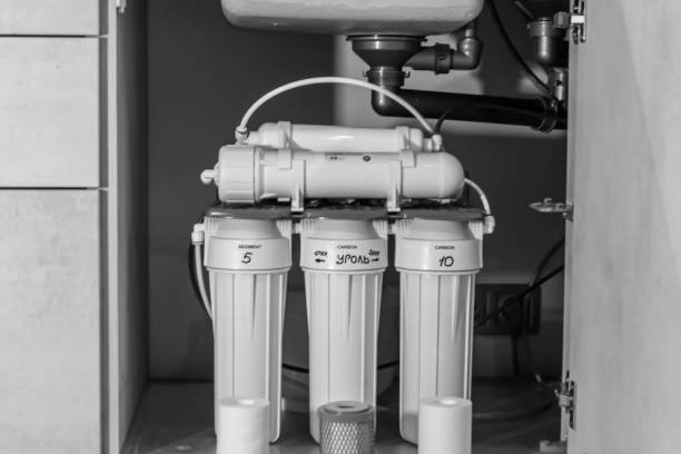 Photography to theme water filter system for home on background kitchen, photo consisting of installing water filter system to home, replacement water filter system in home of clean soft tasty liquid